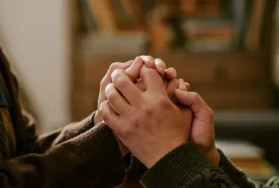 hands being held for grief comfort